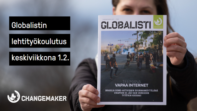 Henkilö pitää Globalisti-lehteä edessään.